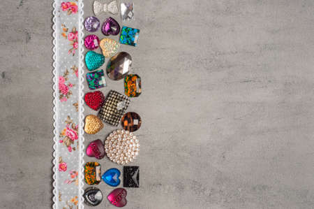 multi-colored sewn stones on a grey background.Copy Spaceの写真素材