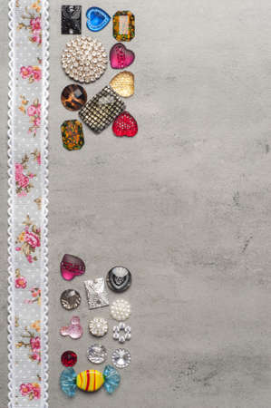 multi-colored sewn stones on a grey background.Copy Spaceの写真素材