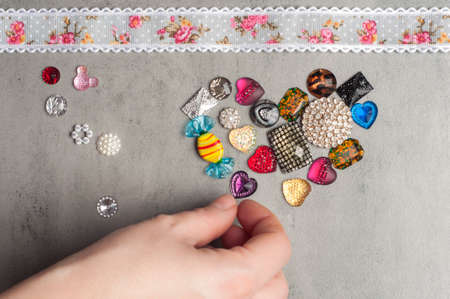 multi-colored sewn stones on a grey background.Copy Spaceの写真素材