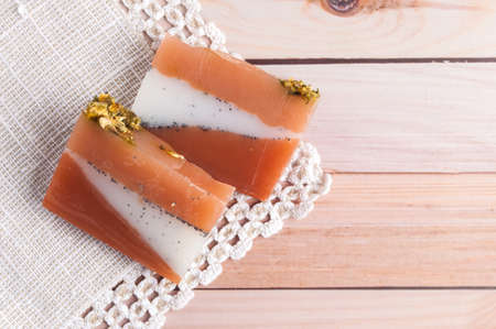 Eco friendly natural solid shampoo and hair conditioner on wooden background. Concept animal fat free, zero waste.の写真素材