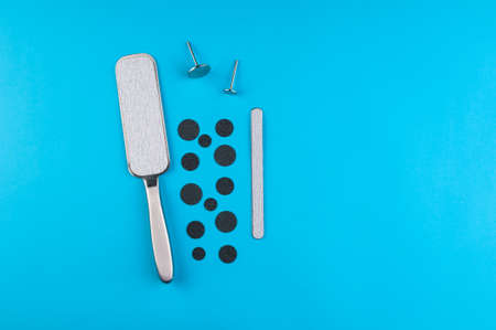 Top view of manicure and pedicure equipment on blue backgroundの写真素材