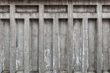 Fragment of a concrete fence. Peeling concrete fence. Peeling concrete wall. background.の写真素材