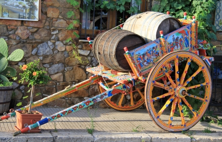 Traditional coloured sicilian cart with 2 wooden barrelsのeditorial素材