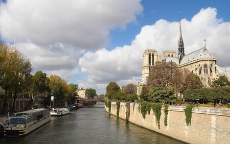Notre Dame of Paris and Sine river with a cloudy blue sky; taken from behind のeditorial素材