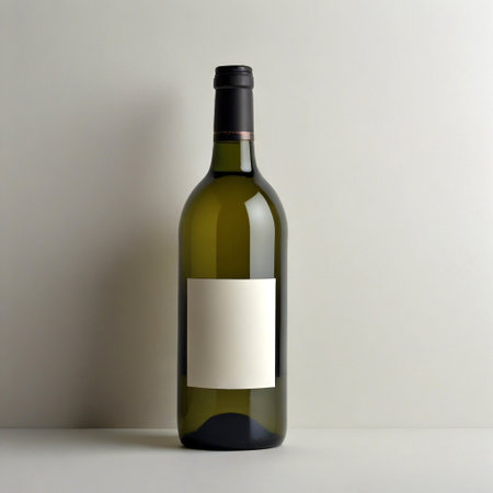 Wine bottle with a blank label stands against a neutral backdrop, perfect for design mockupsの素材