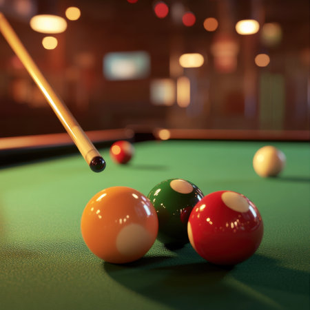 Close-up image of colorful billiard balls and a cue stick on a green pool table, with a blurred warm-lit background, symbolizing leisureの素材