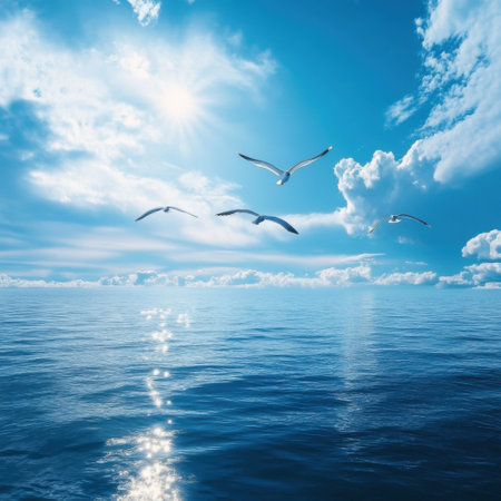 Seagulls soaring over a serene ocean, illuminated by sunlight, surrounded by fluffy clouds, depicting peaceful natureの素材