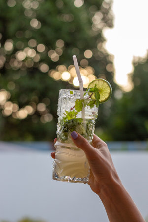 Girl holding mojitoの写真素材