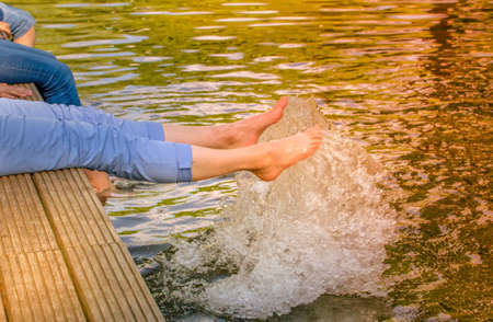 A lady taking enjoy and doing spa on pure lake water