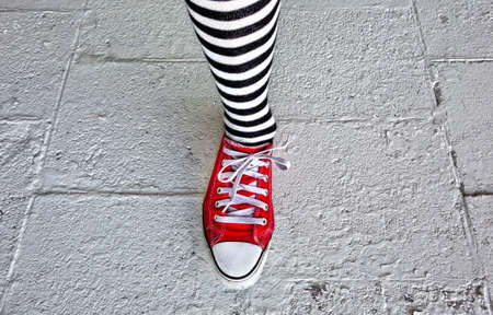 A lady is ready to jog after wearing new shoesの写真素材