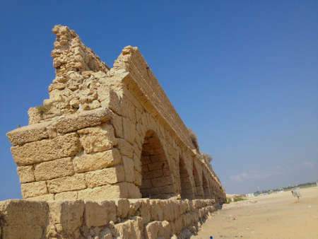 Water aqueduct of old  Roman ruins in Ceasaria.の写真素材