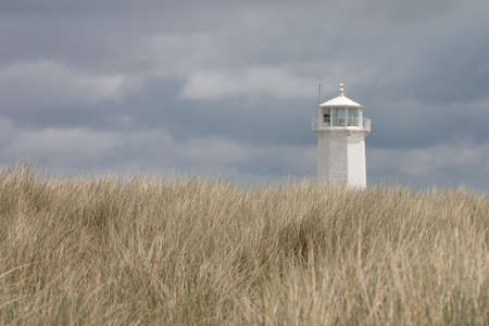 White lighthouse on Walney Islandの写真素材