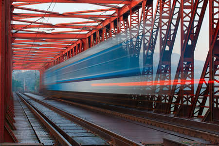 Abstract composition of moving train on the old railway bridge の写真素材