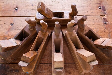 Old wooden jointers on the wood table