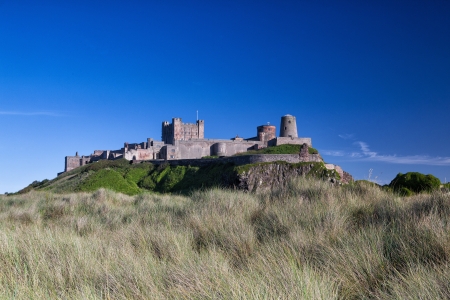 Bamburgh Castle on the empty beach in Englandのeditorial素材