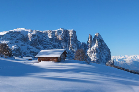 Wooden challet in the Dolomites mountain in winterのeditorial素材