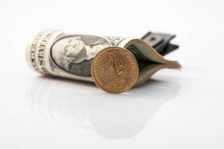 Package of U S  dollar bills on a glass table