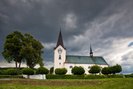 Lonely church in the field before stormの写真素材