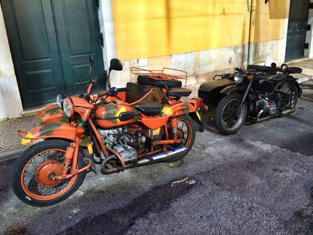 Two historic motorcycles with sidecar