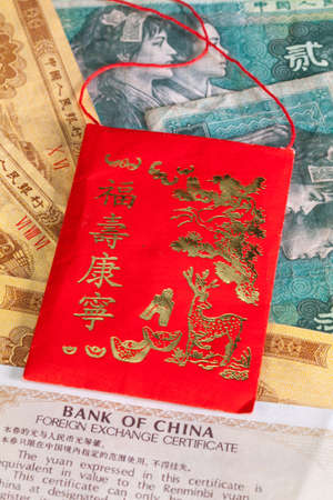 Typical China red envelope and different China banknotesの写真素材