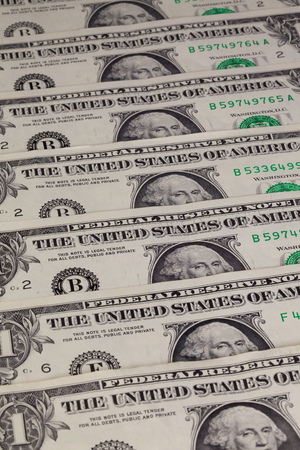 Detail of the same pattern of dollar bills on the table