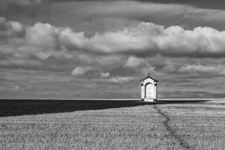 A small chapel in the middle of autumn fieldsの写真素材
