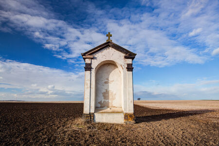 A small chapel in the middle of autumn fieldsの写真素材