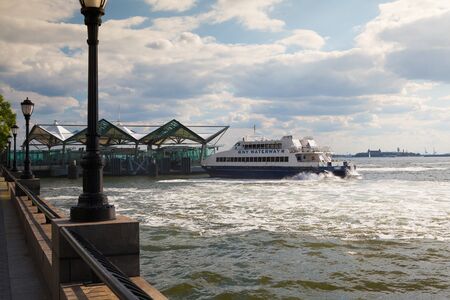 New York,USA- July 30,2013: Hudson River Ferry in Battery Park.NY Waterway is the fastest and most convenient way to NYC, whether you're commuting to work, heading to NYC for dinner or to take in a Broadway Show.のeditorial素材
