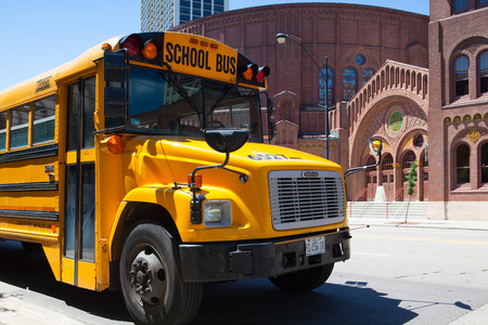 Chicago,USA - July 12,2013 : Typical american yellow school bus in front of the D.L.Moody memorial...