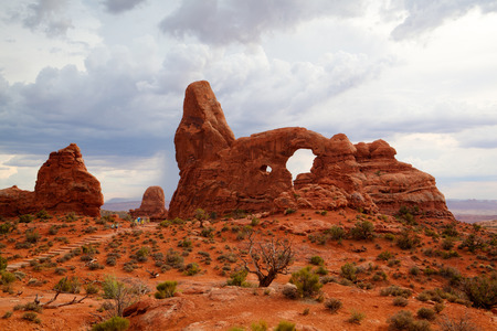 Moab, USA - July 18,2013: Tourists in Arches National Park. - HDR Image.The park is located on the Colorado River 4 miles north of Moab, Utah.It is known for containing over 2,000 natural sandstone archesのeditorial素材