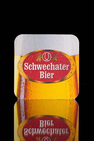 Wien,Austria-December 13,2014: Beermat from Schwechater beer.The history of the Schwechater beer started in the year 1632. Peter Descrolier, who was valet and paymaster of archduke Matthias, founded the brewery in Schwechat.