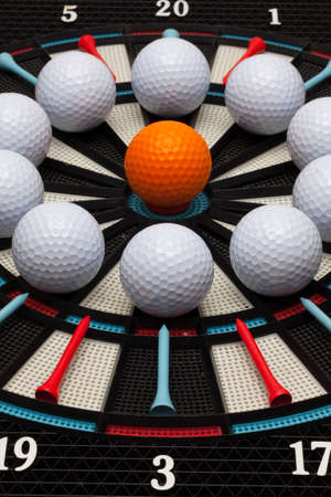 Detail dartboard with different golf ballsの写真素材