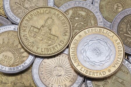 Various coins from Argentina on the tableの写真素材