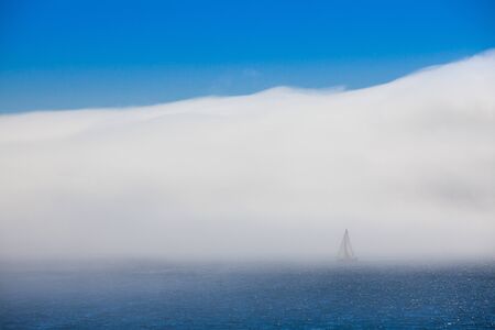 Lonely sailboat in the morning mist, Sanxenxo, Spainの写真素材