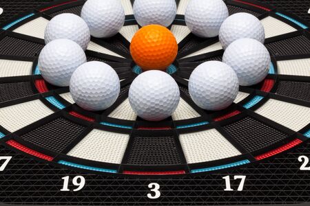 Detail dartboard with different golf ballsの写真素材