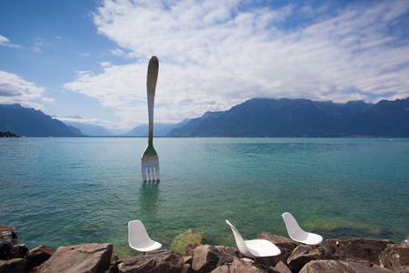 Vevey, Switzerland - July 8,2015: Giant steel fork in water of Geneva lake, Vevey, Switzerland.The fork went up in 1995 to mark the 10th anniversary of the Alimentarium, Veveys Food Museum.のeditorial素材