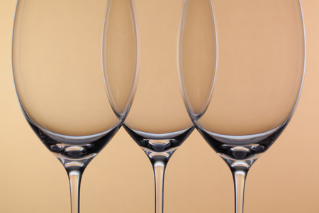 Three empty glasses of wine on a backgroundの写真素材