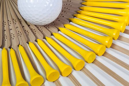 Typical Japanese hand fan made of bamboo and golf equipmentsの写真素材