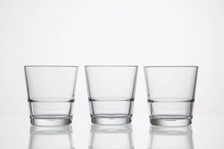 Empty glasses of water on the glass deskの写真素材
