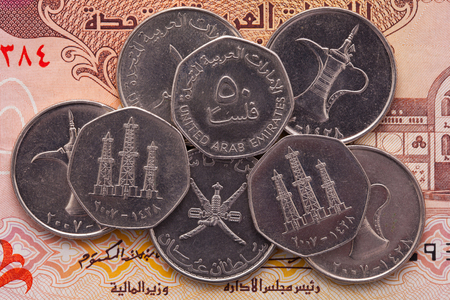 Different banknotes and coins of Arab Emirates Dirham