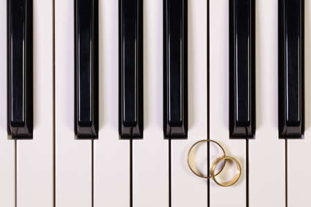Detail of piano keyboard and wedding ringsの写真素材