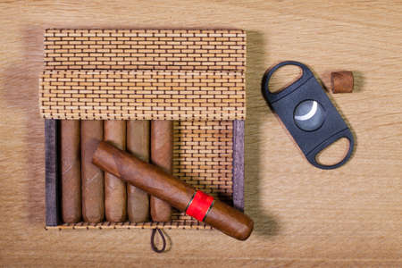 Luxury Cuban cigars on the wooden table