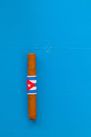 Detail of luxury Cuban cigars on the blue deskの写真素材