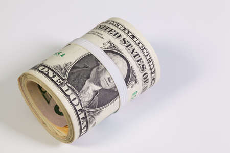 Bribery - The roll of dollar bills with plastic band over the eyes