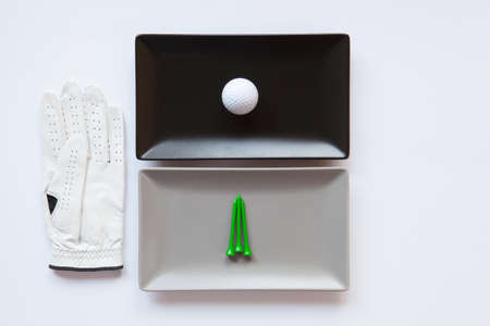 Different  ceramic dishes with golf glove on over white background, rectangle dishの写真素材