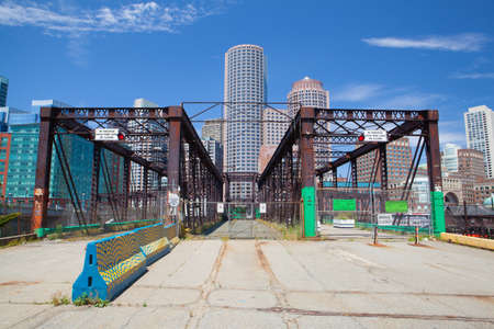BOSTON,MASSACHUSETTS,USA - JULY 15,2016:  Boston skyline and Northern Avenue Bridge. Built in 1908, it was closed to vehicle traffic in 1999のeditorial素材