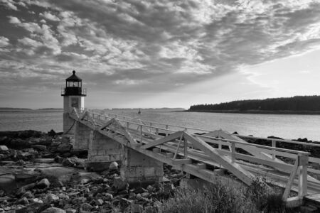 Marshall Point Light as seen from the rocky coast of Port Clyde, Maine.の写真素材
