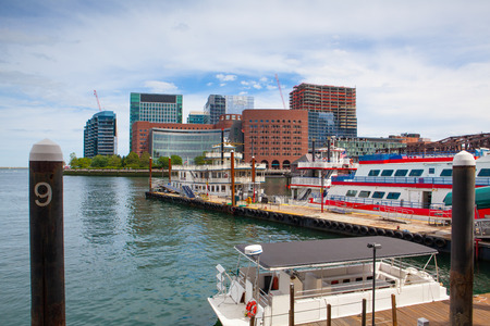 BOSTON,MASSACHUSETTS,USA - JULY 2,2016:  View of Boston from harbor and rowes wharf at sunsetのeditorial素材