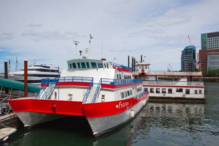 BOSTON,MASSACHUSETTS,USA - JULY 2,2016:  View of Boston from harbor and rowes wharf at sunsetのeditorial素材