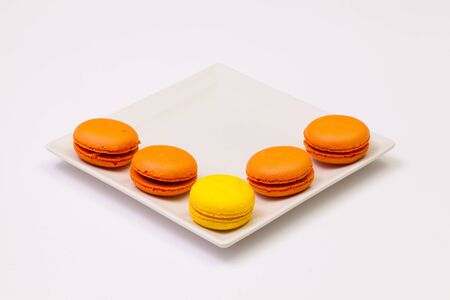 Traditional french colorful macarons on the white plateの写真素材
